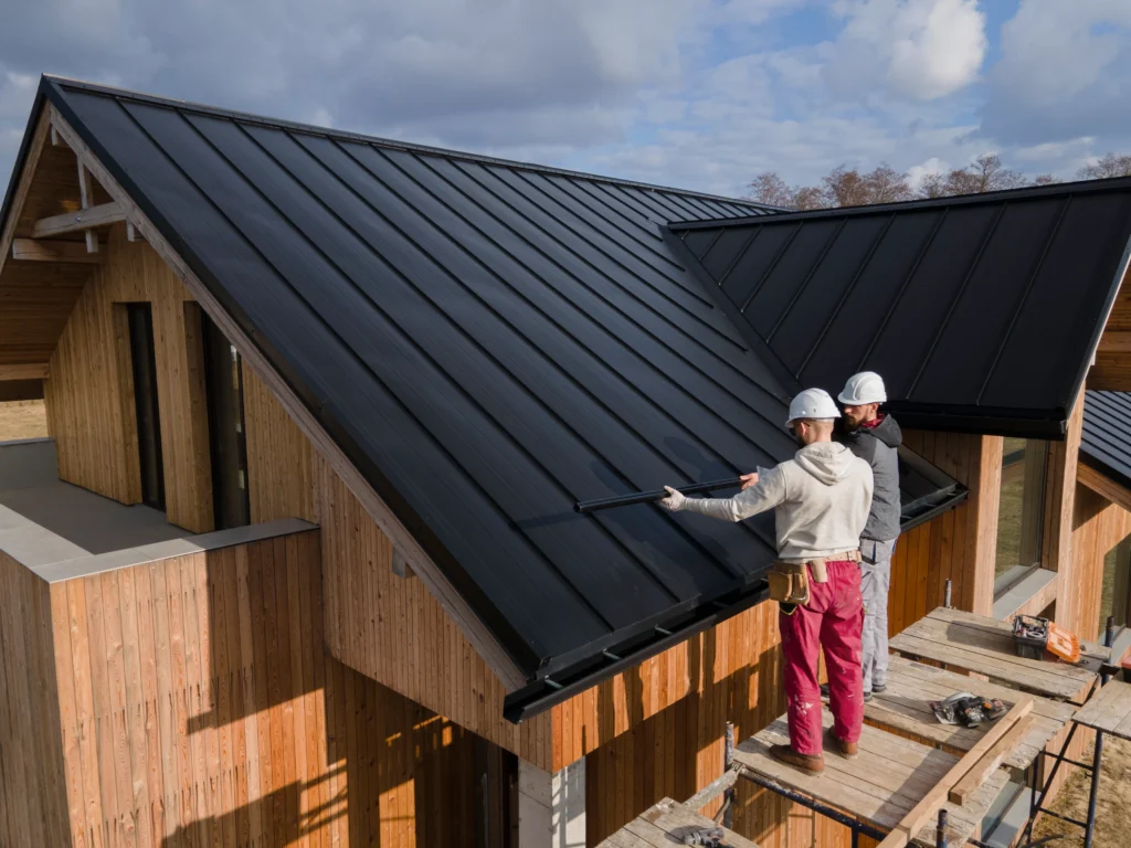 full-shot-roofers-working-together-with-helmets (1)