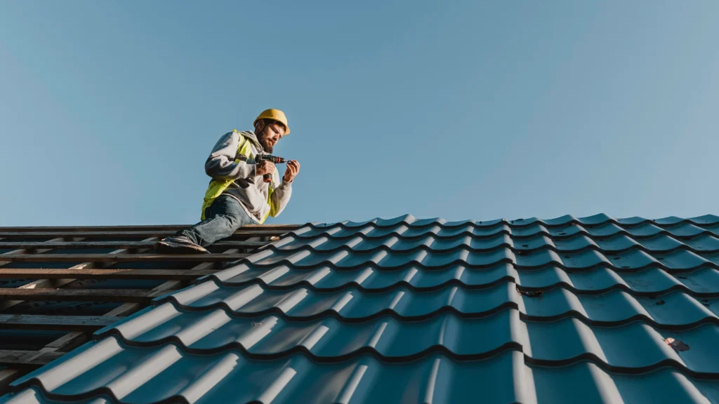 long-shot-man-working-roof.webp