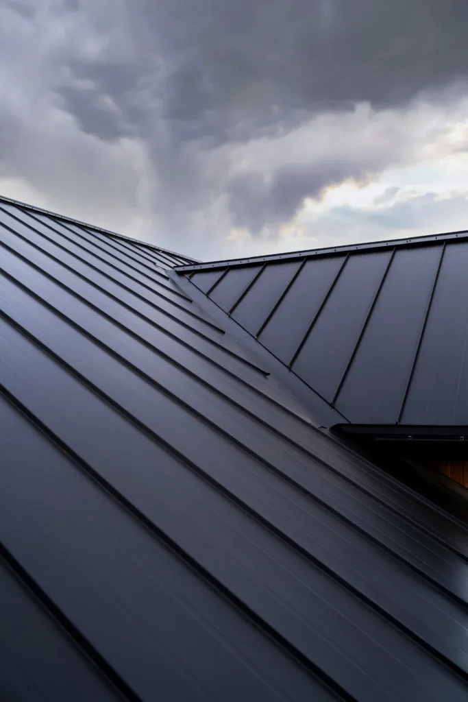 low-angle-modern-house-roof-clouds.webp